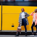 two-young-modern-fashionable-attractive-tall-slim-african-muslim-womans-hijab-turban-head-scarf-coat-posed-against-yellow-bus_627829-4990