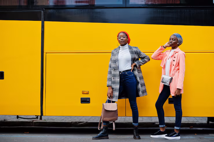 two-young-modern-fashionable-attractive-tall-slim-african-muslim-womans-hijab-turban-head-scarf-coat-posed-against-yellow-bus_627829-4990